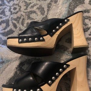 Black slip on w/ a 1 inch heel.